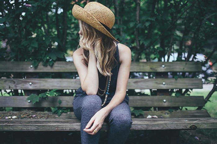 Person on bench contemplating
