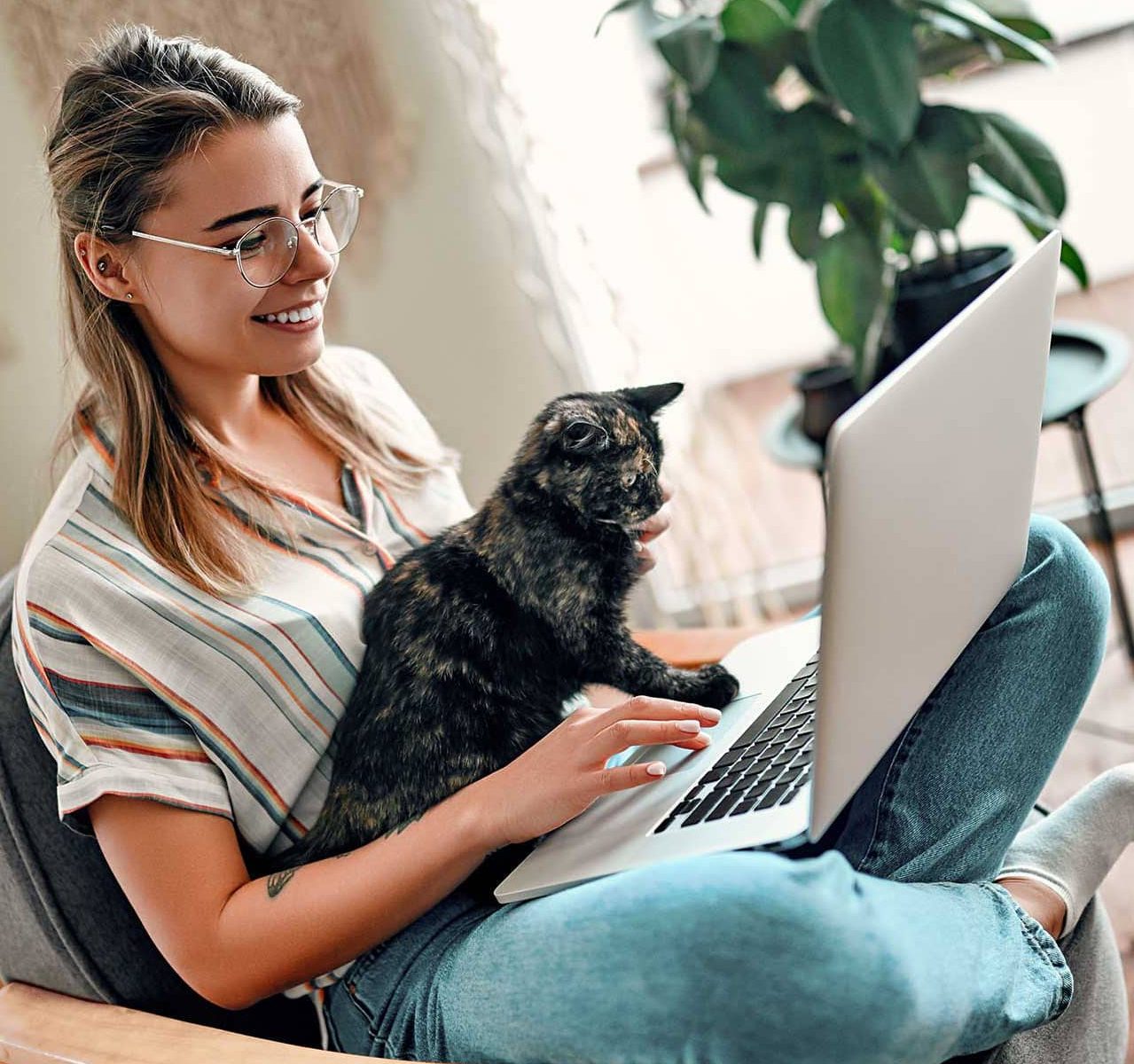 Therapist with their cat happy because they can add a client portal to their therapist website